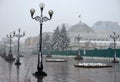 Winter park, winter city landscape. Snow, city, lights and trees in a city park Royalty Free Stock Photo