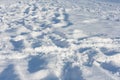 Snow in city park with footprints winter concept on frosty sunny day