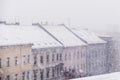 Snow cityscape / rooftops during winter snowing