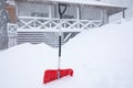 Snow cleaning shovel near house. Winter work