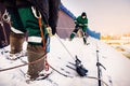 Snow cleaning. Team of male workers clean roof