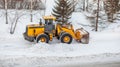 Snow clearing. Tractor clears the way after heavy snowfall.