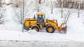 Snow clearing. Tractor clears the way after heavy snowfall.