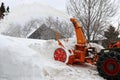 Snow clearing work with a large snow blower in winter