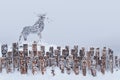 Snow-covered art object in the Perm Krai, Russia, in the form of a group of idols depicting anthropomorphic figures and elk