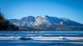 Snow covered beach and mountains at Lake Tahoe, California Royalty Free Stock Photo