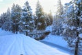 SNow covered beautiful old American rustic country side landscape with bridge, trail and water canal. Peaceful and inspiring Royalty Free Stock Photo