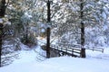 SNow covered beautiful old American rustic country side landscape with bridge, trail and water canal. Peaceful and inspiring Royalty Free Stock Photo