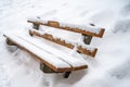 Snow covered bench. Deep snow in winter. Tranquil scene. Les Pleiades, Switzerland