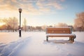 snow-covered bench, a lone path of boot prints Royalty Free Stock Photo