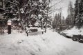 A snow covered bench in Vail, Colorado during the winter. Royalty Free Stock Photo