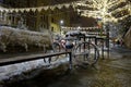 Snow-covered bicycle at night on Horea Street