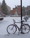 snow-covered bicycle parked in the town square, Jagodina, Serbia