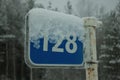 Snow-covered blue kilometer sign Royalty Free Stock Photo