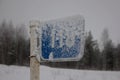 Snow-covered blue kilometer sign Royalty Free Stock Photo