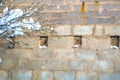 Snow-covered branch on the background of concrete blocks Royalty Free Stock Photo