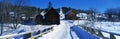 Snow covered bridge in New England town Royalty Free Stock Photo