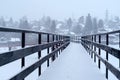Snow-covered bridge over the river in the winter countryside Royalty Free Stock Photo