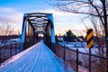 Snow covered bridge at sunset in Vermont Royalty Free Stock Photo