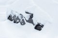 Snow-covered car on a street during snowstorm in Moscow, Russia Royalty Free Stock Photo