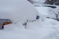 Snow-covered car, under a pile of snow, after a snowstorm Royalty Free Stock Photo