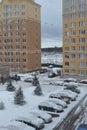 Snow covered cars near the house Royalty Free Stock Photo