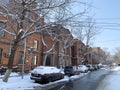 Snow covered cars are parked on Pushkinskaya street next to the building of the far Eastern state technical University