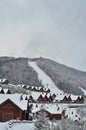 Snow covered chalet, winter background with copy space