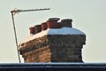 A snow covered chimney in the winter