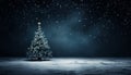 Snow covered christmas tree with colorful ornaments on dark blue background, a festive holiday scene Royalty Free Stock Photo