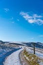 Snow covered Cleeve Hill, Cotwolds, Gloucestershire, UK on a sunny winters day