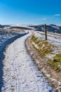 Snow covered Cleeve Hill, Cotwolds, Gloucestershire, UK on a sunny winters day