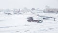 Snow covered commercial plane at the airport. Close-up of the plane after snowfall. Winter bad weather conditions