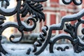 Snow-covered decorative yard gate from metal - image Royalty Free Stock Photo