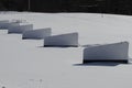 snow covered driving range, dividers covered partially