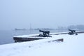 Onega lake embankment with guns in winter