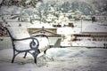 Snow covered empty bench Royalty Free Stock Photo