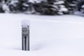 Snow covered engine block heater a parking lot in middle of a snow storm