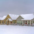 Snow covered festive homes in Daybreak Utah