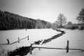 Snow covered field with creek Royalty Free Stock Photo