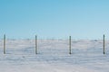 Snow covered fields and wire fence Royalty Free Stock Photo