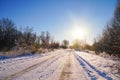 Snow covered forest country road on winter sunny day Royalty Free Stock Photo