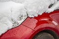 Snow-covered frozen car covered with snow. Winter road. Danger of winter driving. Car snow removal. Dangerous traffic situation Royalty Free Stock Photo