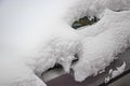 Snow-covered frozen car covered with snow. Winter road. Danger of winter driving. Car snow removal. Dangerous traffic situation Royalty Free Stock Photo