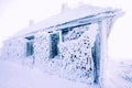 snow covered frozen hut in mountains in winter Royalty Free Stock Photo