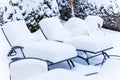 Snow-covered garden furniture