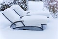 Snow-covered garden furniture