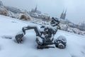 Snow covered gnome in a winter scenery, in the background a visible St. John the Baptist Cathedral - WrocÃâaw, Poland