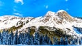 The snow covered granite rock face of Yak Peak in the Zopkios Ridge of the Cascade Mountain Range near the Coquihalla Summit Royalty Free Stock Photo