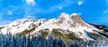 The snow covered granite rock face of Yak Peak in the Zopkios Ridge of the Cascade Mountain Range near the Coquihalla Summit Royalty Free Stock Photo